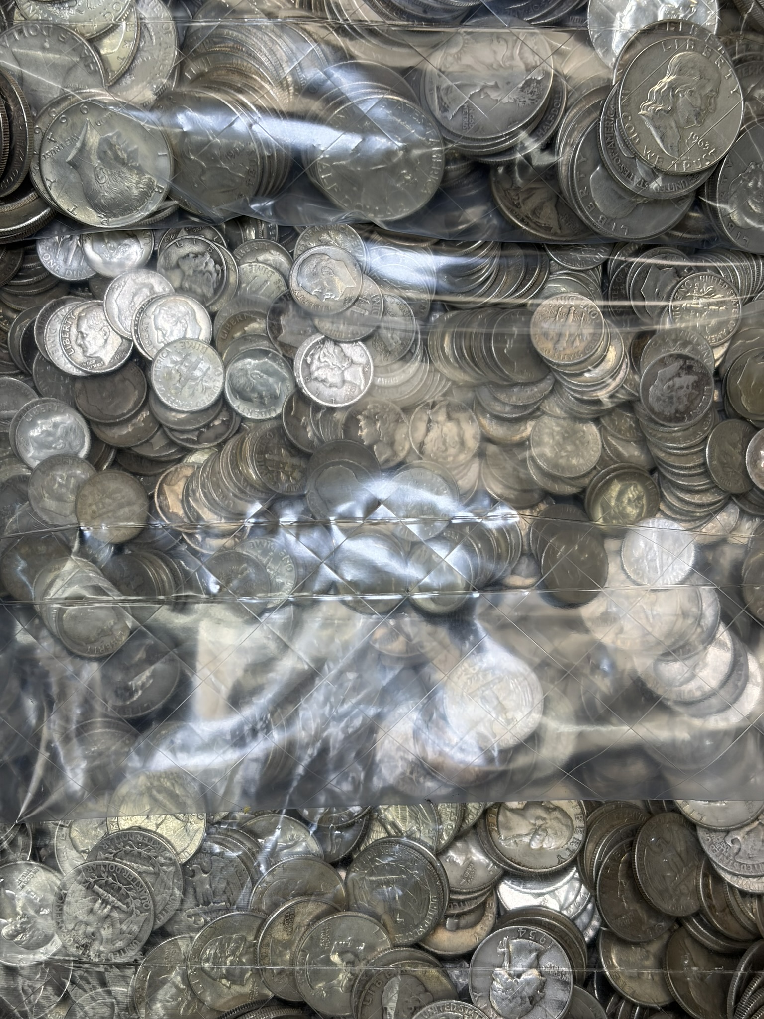 Bulk silver coin collection in trays at Gold King, Hickory, NC