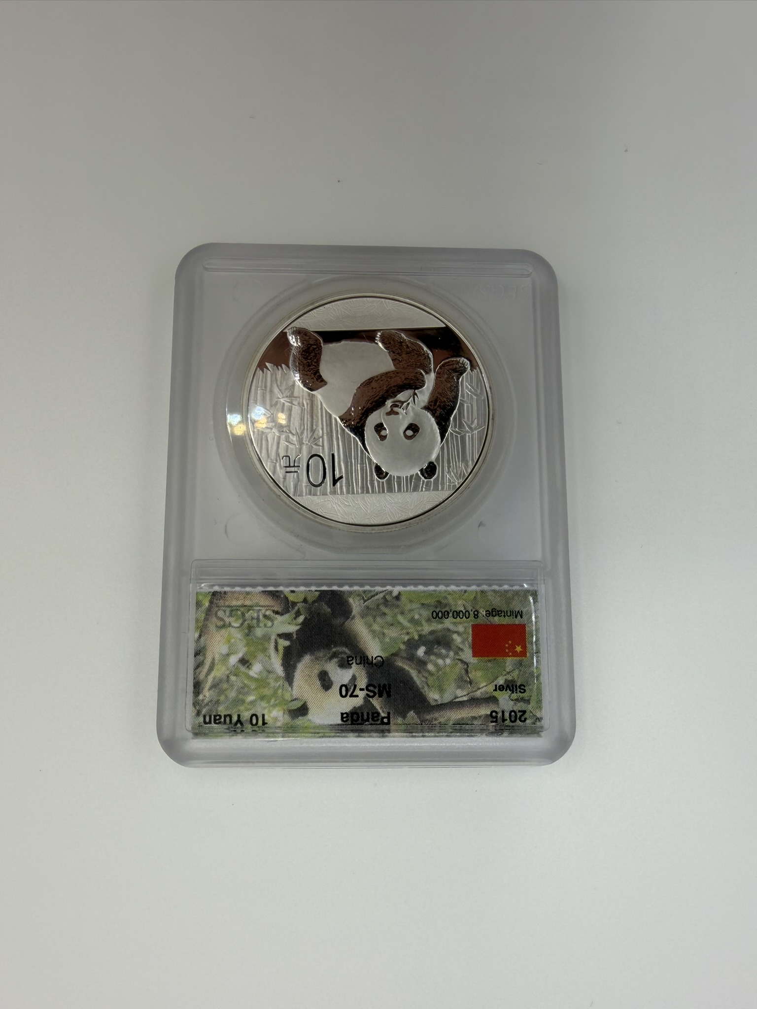 Chinese silver panda coin with flag design at Gold King in Hickory, NC