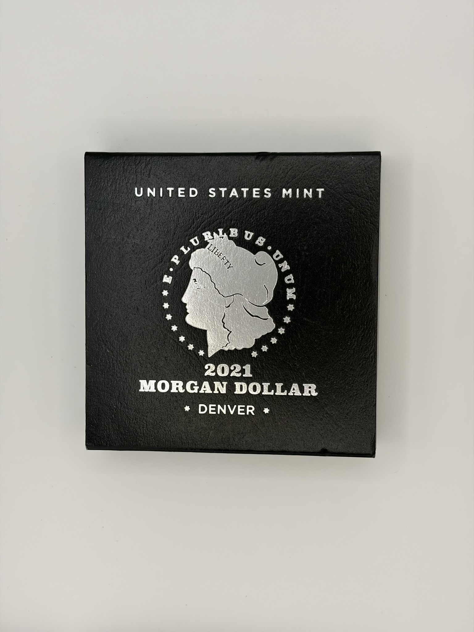 Morgan silver dollar in a mint set holder at Gold King in Hickory, NC