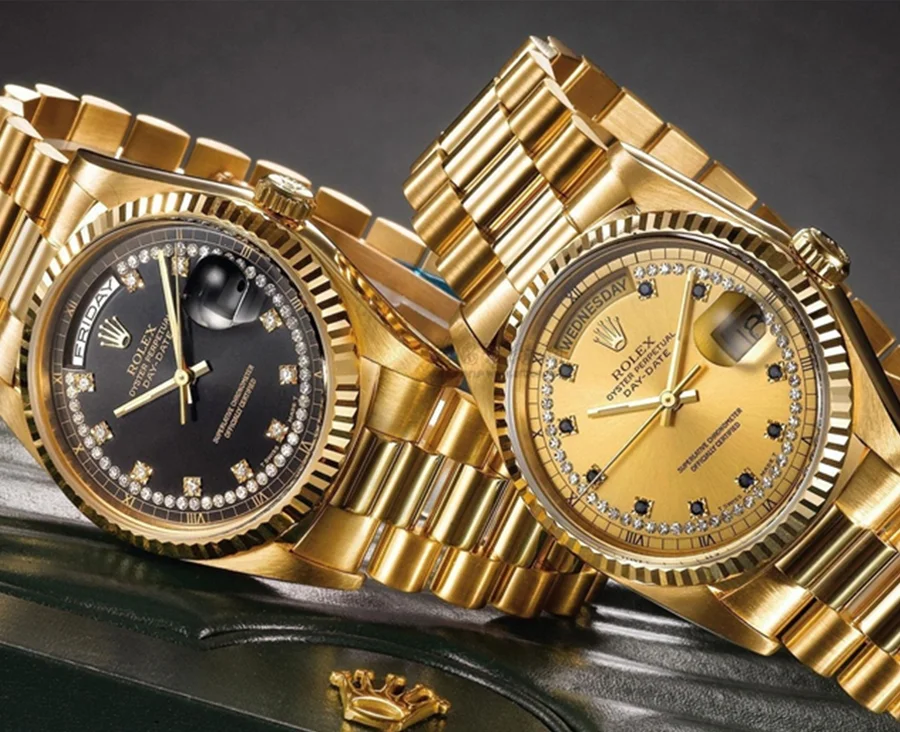 closeup shot of the two gold watches